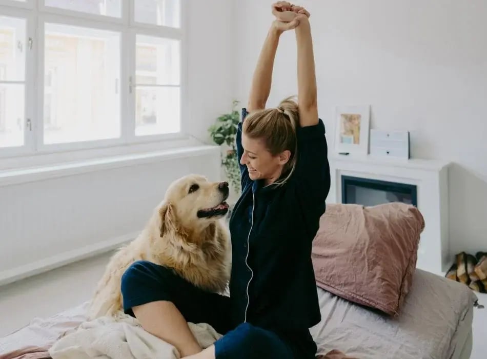 woman stretching on bed