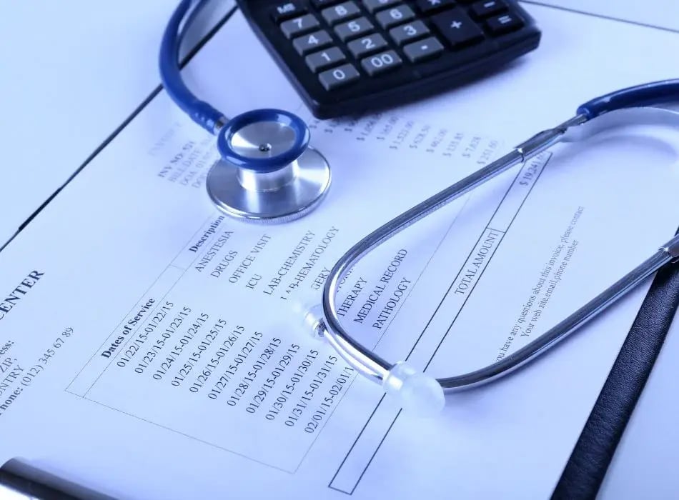 medical bills with a calculator