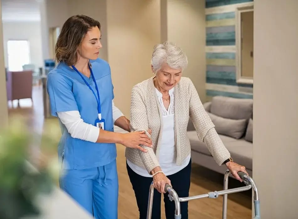nurse with woman and a walker