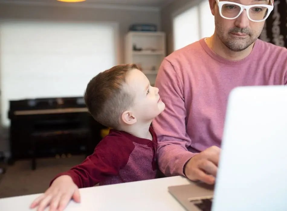 dad at computer with son